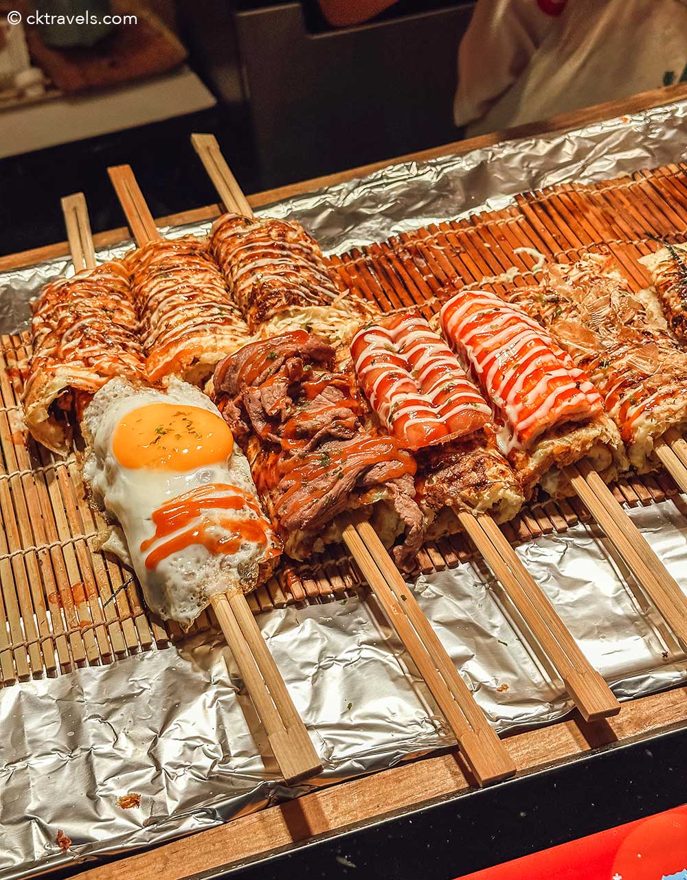 Jodd Fairs DanNeramit Night Market in Bangkok okonomiyaki stick