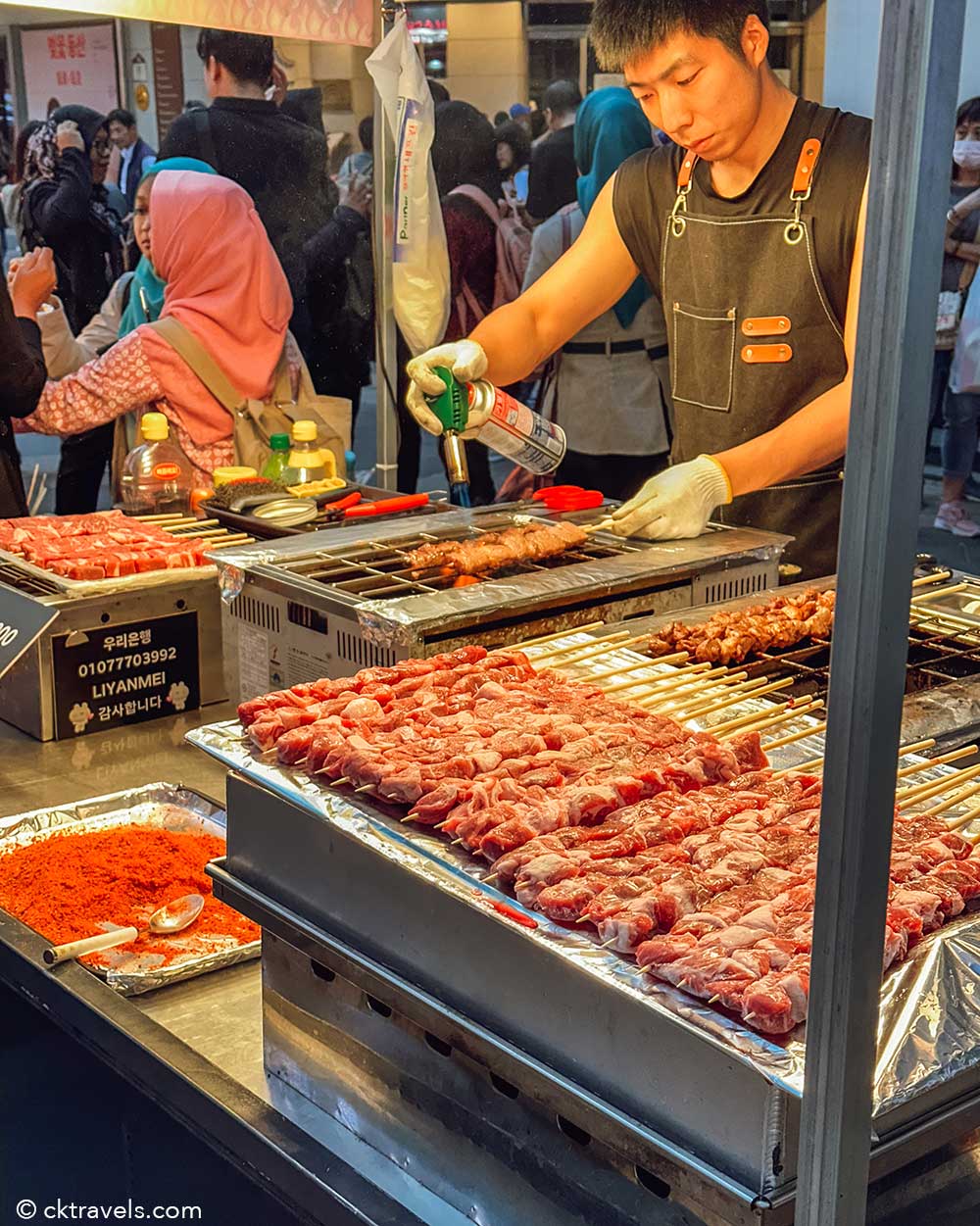 meat skewers blow torch korean street food market